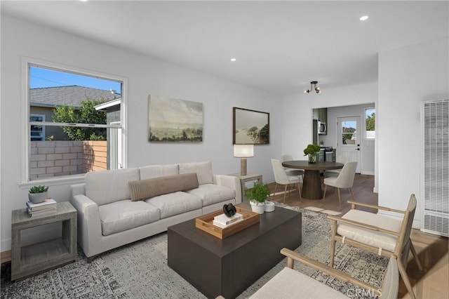 14712 Helwig Ave, Norwalk, CA 90650 - living room featuring a heating unit, recessed lighting, and wood finished floors