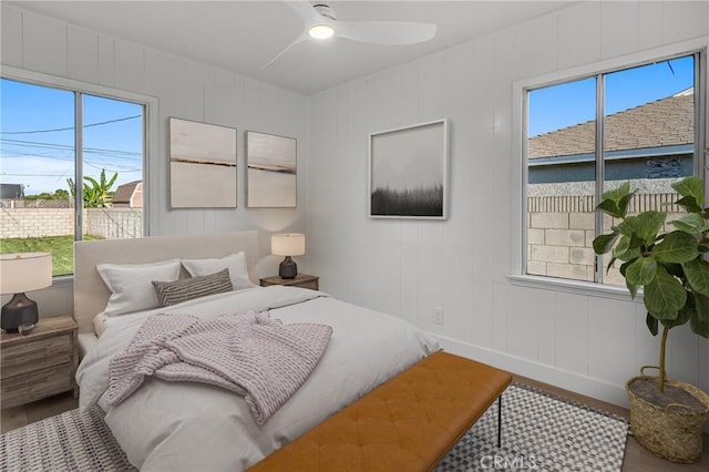 14712 Helwig Ave, Norwalk, CA 90650 - bedroom with wood finished floors, multiple windows, and ceiling fan