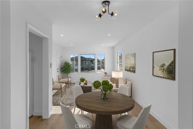 14712 Helwig Ave, Norwalk, CA 90650 - dining space with a chandelier, light wood-type flooring, and recessed lighting