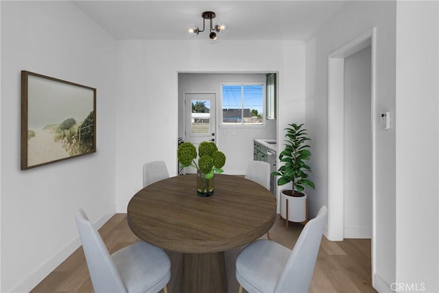 14712 Helwig Ave, Norwalk, CA 90650 - dining area with light wood-style flooring and baseboards