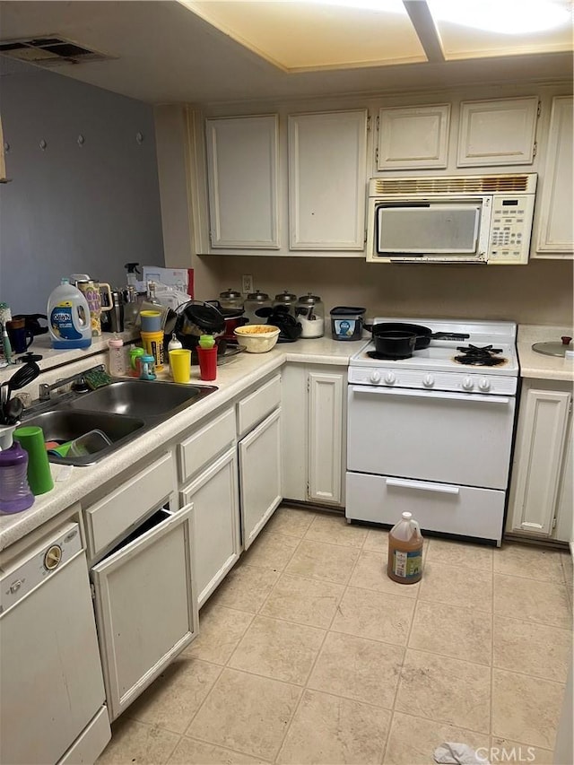 1025 N Tippecanoe Ave Unit 238, San Bernardino, CA 92410 - kitchen with white appliances, light countertops, and light tile patterned floors