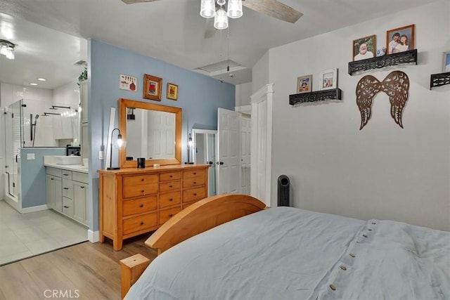 10784 Cole Way, Grass Valley, CA 95945 - bedroom with light wood-type flooring, ceiling fan, and connected bathroom