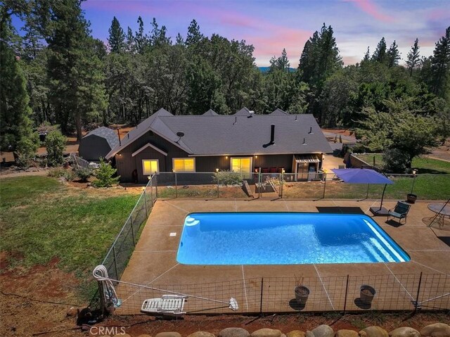 10784 Cole Way, Grass Valley, CA 95945 - pool at dusk featuring a patio