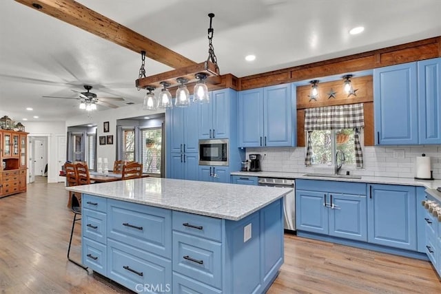 10784 Cole Way, Grass Valley, CA 95945 - kitchen with blue cabinets, appliances with stainless steel finishes, healthy amount of natural light, light wood finished floors, and recessed lighting
