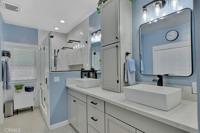 10784 Cole Way, Grass Valley, CA 95945 - bathroom with a stall shower, double vanity, tile patterned floors, and recessed lighting