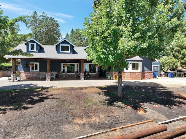10784 Cole Way, Grass Valley, CA 95945 - view of front facade featuring brick siding, a porch, and roof with shingles