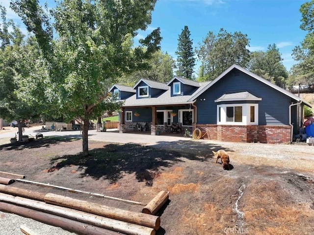 10784 Cole Way, Grass Valley, CA 95945 - view of front facade featuring brick siding and covered porch