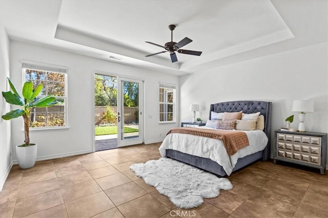 31521 Paseo Campeon, San Juan Capistrano, CA 92675 - tiled bedroom featuring a tray ceiling, access to outside, and ceiling fan
