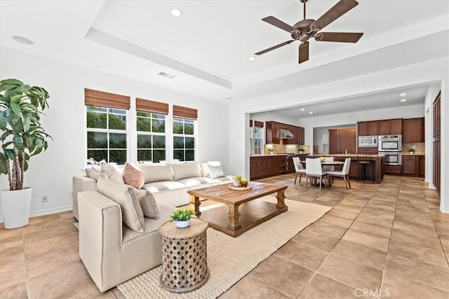 31521 Paseo Campeon, San Juan Capistrano, CA 92675 - living area with a tray ceiling, recessed lighting, a ceiling fan, and light tile patterned flooring