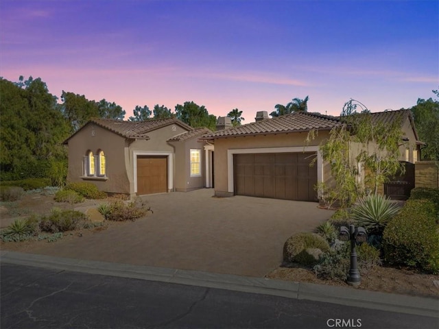 31521 Paseo Campeon, San Juan Capistrano, CA 92675 - mediterranean / spanish house with a garage, a tiled roof, stucco siding, and driveway