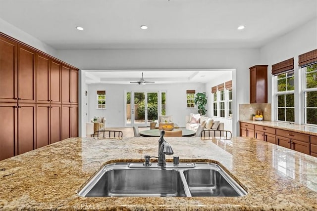 31521 Paseo Campeon, San Juan Capistrano, CA 92675 - kitchen with plenty of natural light, light stone counters, recessed lighting, a ceiling fan, and open floor plan
