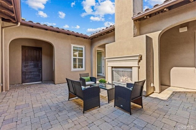 31521 Paseo Campeon, San Juan Capistrano, CA 92675 - view of patio with an outdoor living space with a fireplace
