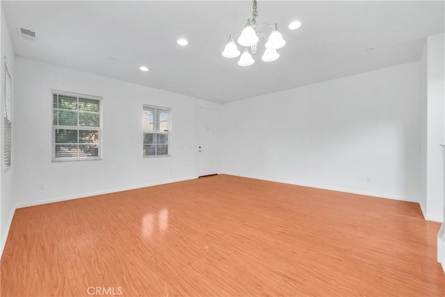 4564 Vincent Way, Riverside, CA 92501 - spare room featuring a chandelier, light wood-type flooring, and recessed lighting