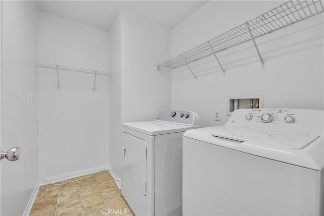 4564 Vincent Way, Riverside, CA 92501 - washroom featuring washer and clothes dryer and light stone finish floors