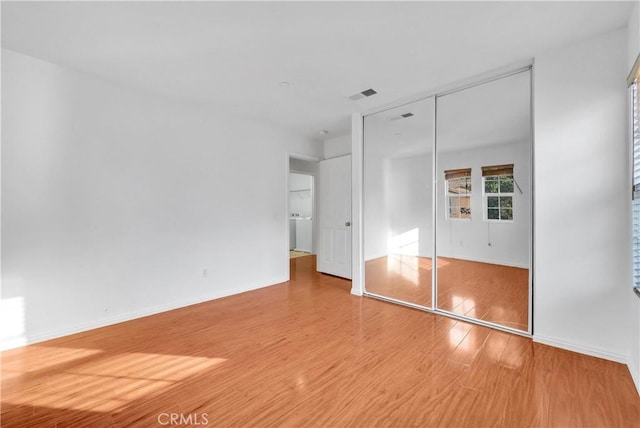 4564 Vincent Way, Riverside, CA 92501 - unfurnished bedroom featuring wood finished floors and a closet