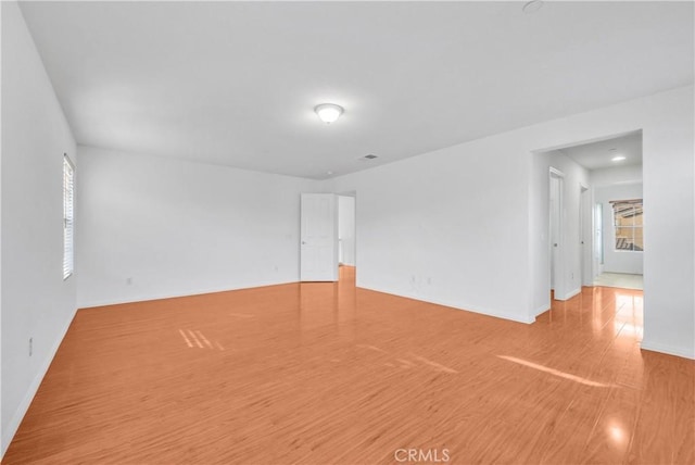 4564 Vincent Way, Riverside, CA 92501 - empty room with wood finished floors and healthy amount of natural light