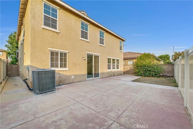 4564 Vincent Way, Riverside, CA 92501 - back of property featuring stucco siding, a fenced backyard, and a patio area