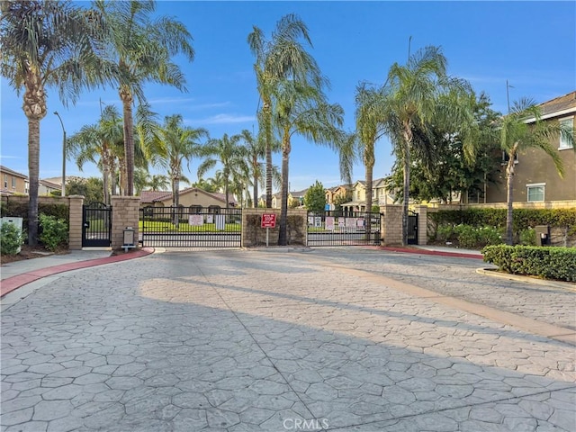 4564 Vincent Way, Riverside, CA 92501 - view of street featuring a gate, a gated entry, curbs, a residential view, and sidewalks