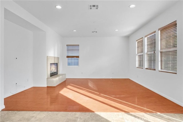 4564 Vincent Way, Riverside, CA 92501 - unfurnished living room with a glass covered fireplace and recessed lighting