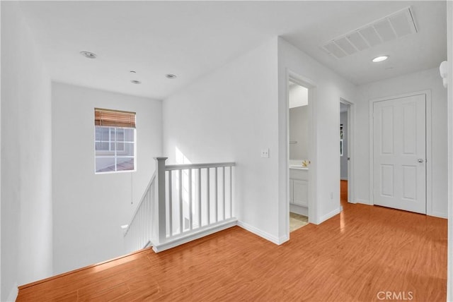 4564 Vincent Way, Riverside, CA 92501 - empty room with light wood-style floors and recessed lighting