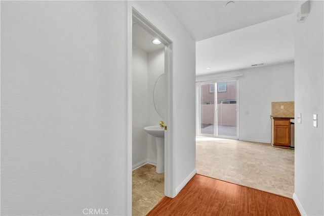 4564 Vincent Way, Riverside, CA 92501 - corridor featuring baseboards and wood finished floors
