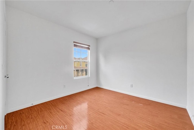 4564 Vincent Way, Riverside, CA 92501 - empty room with wood finished floors and baseboards