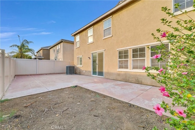 4564 Vincent Way, Riverside, CA 92501 - rear view of house featuring stucco siding, a patio, and a fenced backyard