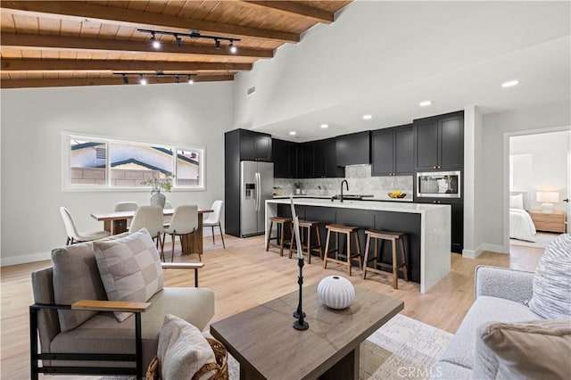 9712 Saloma Ave, North Hills, CA 91343 - living room featuring wooden ceiling and light wood-style floors