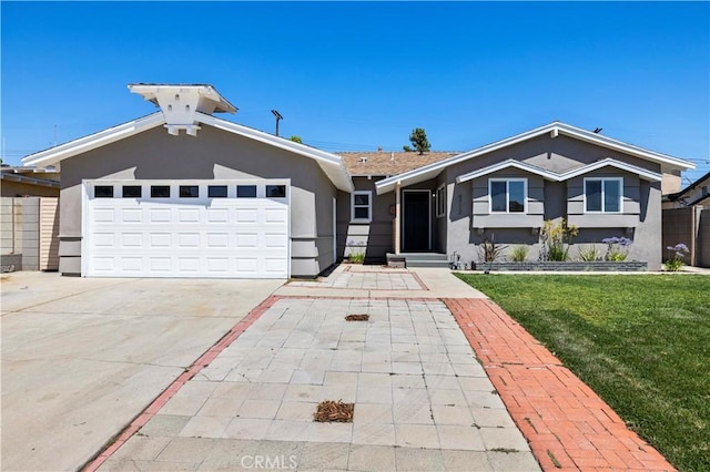 9712 Saloma Ave, North Hills, CA 91343 - ranch-style house featuring stucco siding, a front lawn, a garage, and driveway