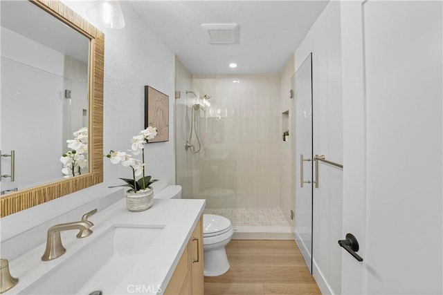 2000 Pacific Coast Hwy Unit 313, Huntington Beach, CA 92649 - full bath with a stall shower, vanity, and wood finished floors