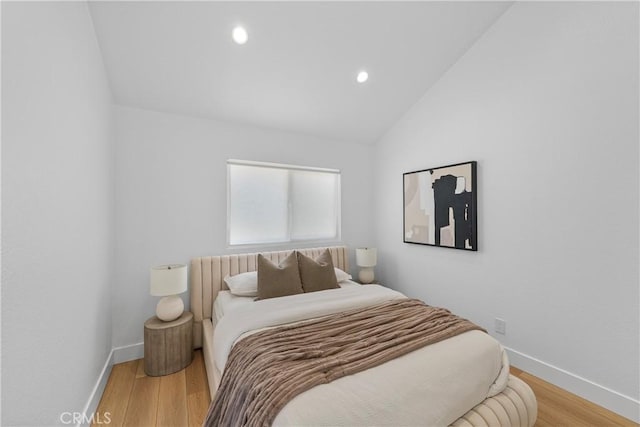 2000 Pacific Coast Hwy Unit 313, Huntington Beach, CA 92649 - bedroom featuring lofted ceiling, wood finished floors, and recessed lighting