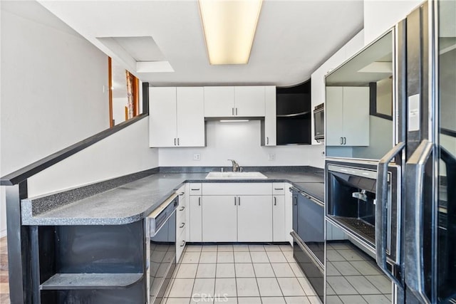 17162 Grand Ave, Lake Elsinore, CA 92530 - kitchen with refrigerator, black dishwasher, dark countertops, white cabinets, and light tile patterned flooring