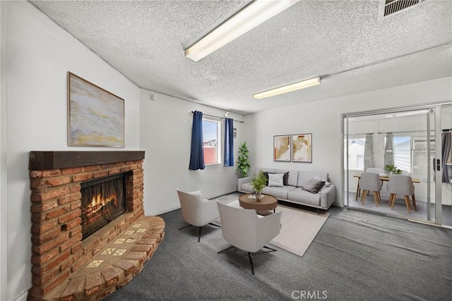 17162 Grand Ave, Lake Elsinore, CA 92530 - carpeted living room featuring a textured ceiling and a brick fireplace
