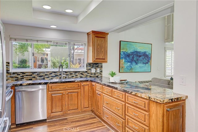 2164 Via Mariposa E Unit D, Laguna Woods, CA 92637 - kitchen featuring dishwasher, dark stone counters, a peninsula, backsplash, and recessed lighting