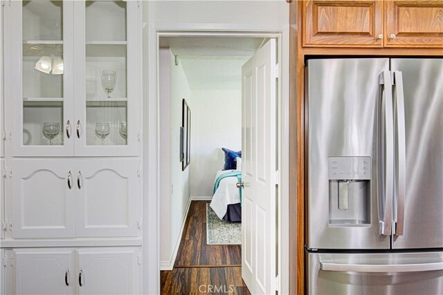 2164 Via Mariposa E Unit D, Laguna Woods, CA 92637 - hallway featuring dark wood-style floors and baseboards