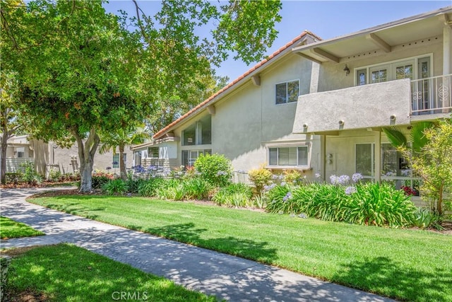 2164 Via Mariposa E Unit D, Laguna Woods, CA 92637 - view of home's community with a lawn