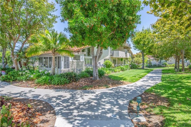 2164 Via Mariposa E Unit D, Laguna Woods, CA 92637 - view of front of property featuring a front yard