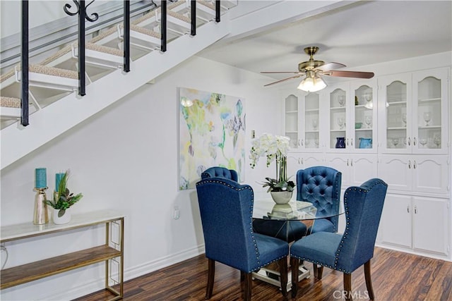 2164 Via Mariposa E Unit D, Laguna Woods, CA 92637 - dining space featuring stairway, dark wood-style floors, and a ceiling fan
