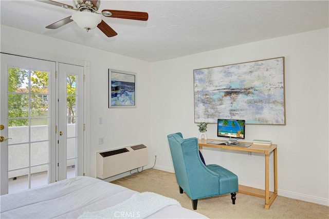 2164 Via Mariposa E Unit D, Laguna Woods, CA 92637 - carpeted bedroom with access to outside, ceiling fan, radiator, and a desk