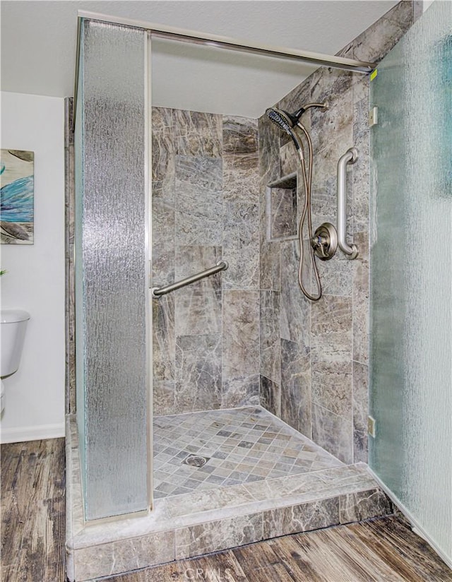2164 Via Mariposa E Unit D, Laguna Woods, CA 92637 - full bathroom with a stall shower and wood finished floors
