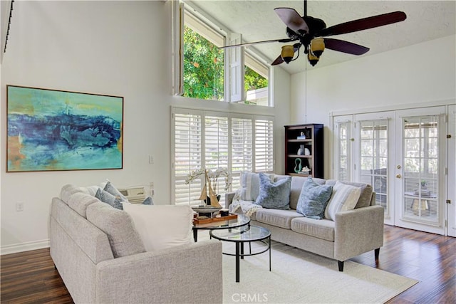 2164 Via Mariposa E Unit D, Laguna Woods, CA 92637 - living area featuring ceiling fan, wood finished floors, high vaulted ceiling, and french doors