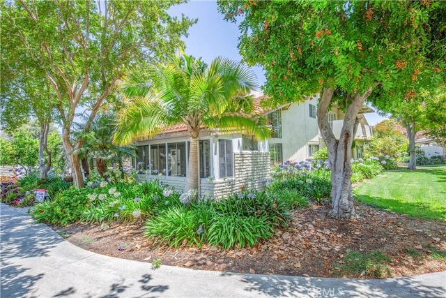 2164 Via Mariposa E Unit D, Laguna Woods, CA 92637 - view of side of property featuring a sunroom