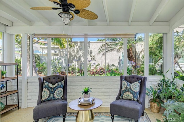 2164 Via Mariposa E Unit D, Laguna Woods, CA 92637 - sunroom featuring tile patterned flooring, beam ceiling, a ceiling fan, and healthy amount of natural light