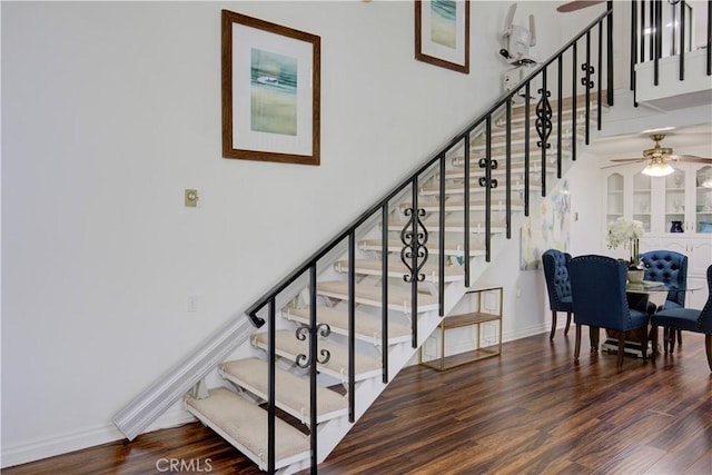 2164 Via Mariposa E Unit D, Laguna Woods, CA 92637 - staircase featuring ceiling fan and wood finished floors