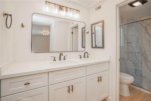 812 San Juan Ln, Placentia, CA 92870 - full bathroom featuring double vanity, a marble finish shower, and wood finished floors