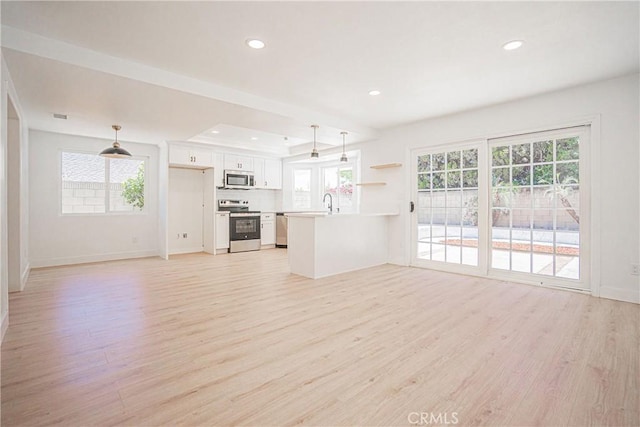 812 San Juan Ln, Placentia, CA 92870 - kitchen featuring appliances with stainless steel finishes, light wood-type flooring, open floor plan, plenty of natural light, and recessed lighting
