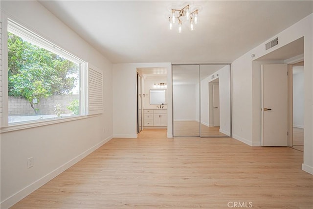 812 San Juan Ln, Placentia, CA 92870 - unfurnished bedroom with light wood-style flooring, connected bathroom, and a closet