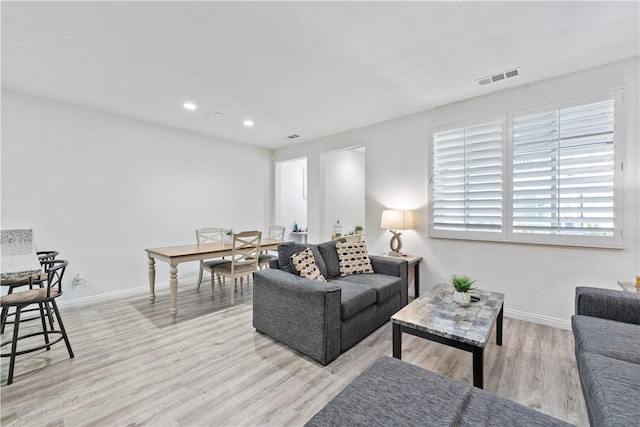 2848 E Berry Loop Privado Unit 52, Ontario, CA 91761 - living room featuring light wood-style flooring and recessed lighting