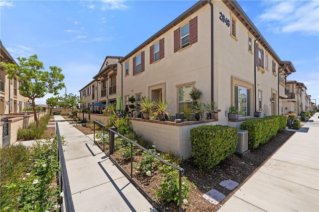2848 E Berry Loop Privado Unit 52, Ontario, CA 91761 - view of building exterior with a residential view