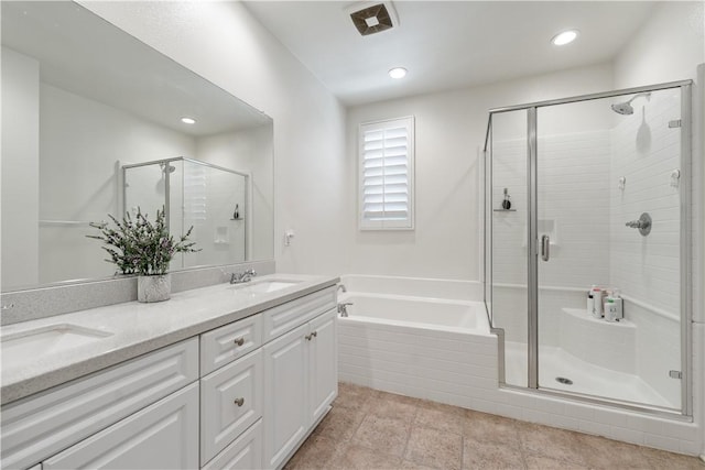 2848 E Berry Loop Privado Unit 52, Ontario, CA 91761 - bathroom featuring a bath, double vanity, a stall shower, and recessed lighting